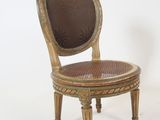 chair made of wood and wicker with a brown seat and back