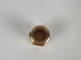 a close up of a metal nut on a white surface