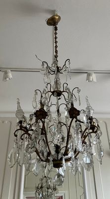 a chandelier hanging from the ceiling in a room