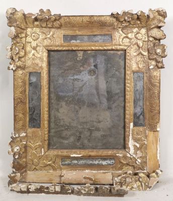 an image of a gold frame with a picture of a woman on it