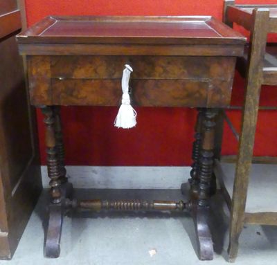 a wooden table with a tassel on top of it