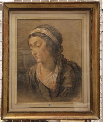 painting of a woman in a turban by a brick wall