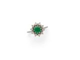 an emerald and diamond cluster ring