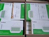 several boxes of white and green paper are stacked on top of each other
