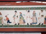 framed picture of a group of people dressed in traditional clothing