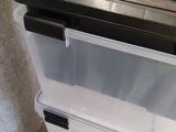 a large plastic box with a lid on top of it
