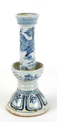 a blue and white vase with a bird on it