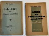 two books sitting on top of a table next to each other