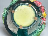 a glass plate with a flower decoration on it