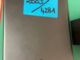an image of a laptop with a sticker on it sitting on a table