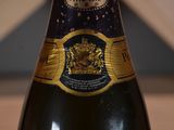 a close up of a bottle of wine on a table