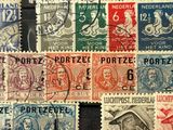 many different types of stamps on a black surface