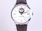 une montre blanche avec un bracelet en cuir marron