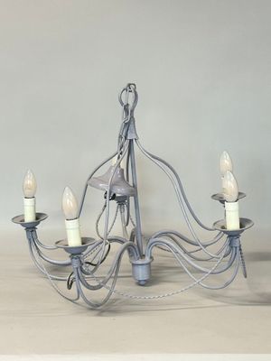a chandelier with five lights hanging from it