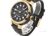 men ' s watch with black dial and gold case and black leather strap