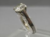 a close up of a ring with a diamond on top of it