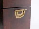 a wooden box with a brass handle on a white background