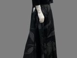 mannequin dressed in black and white dress with floral pattern