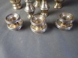 a lot of silver vases sitting on a table
