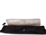 two black and white yoga mats with a white and black bag