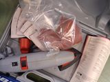 a box with scissors and other items inside of it