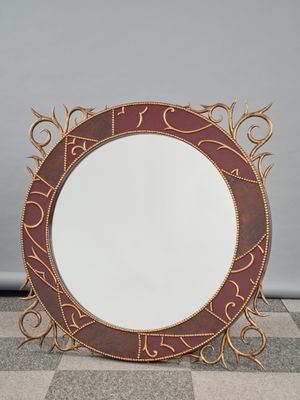 an image of a round mirror sitting on top of a checkered floor