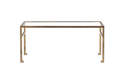 an image of a glass and brass console table on a white background