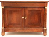 a small wooden cabinet with two doors on it