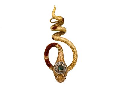 une image représentant un serpent en or tenant une pierre verte dans la bouche