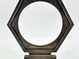 an old silver frame with a picture on it on a white background