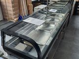 a glass display case in the middle of a room