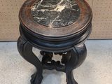 an image of a marble top table with a wooden base