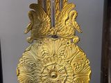 a clock that is sitting on a table with a clock on it