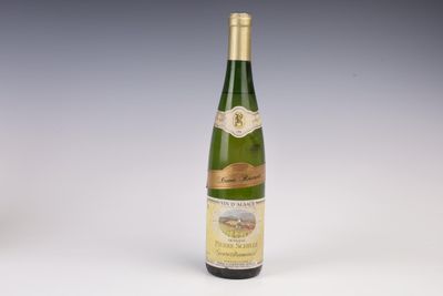 a bottle of wine that is sitting on a table