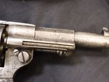 a gun that is sitting on a table