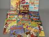 a pile of children ' s books sitting on top of a table