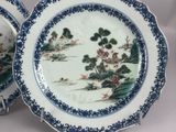two plates that are sitting side by side on a table