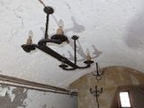 a chandelier hanging from the ceiling in a room