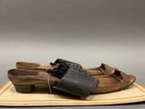 a pair of shoes that are tied up on a rug