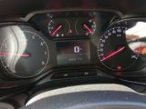 a close up of a car dashboard with a speedometer and gauges