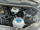 a car engine with the hood open and the hood down