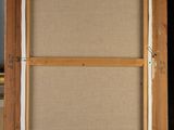 an easel with a painting on it sitting in front of a window