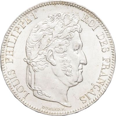 a close up of a coin with a man ' s face on it