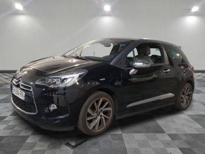 the black citrole is parked on a checkered tile floor