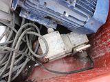 a pile of wires and a blower sitting in a red container