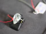 a wire that has a glass bead attached to it
