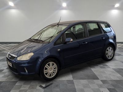 a picture of a small blue car parked in a garage