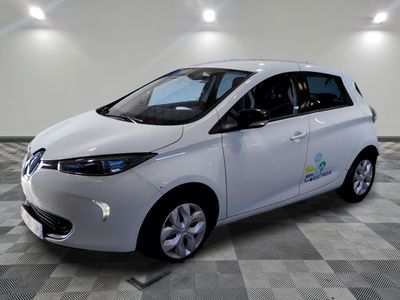 a picture of a small white car on a checkered floor