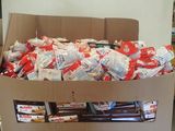 a cardboard box filled with candy and candy bars