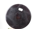 a person holding a black object in their hand